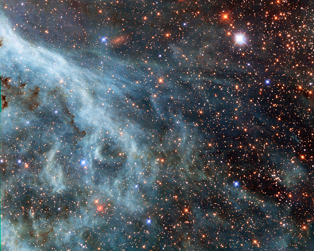 The brightly glowing plumes seen in this image are reminiscent of an underwater scene, with turquoise-tinted currents and nebulous strands reaching out into the surroundings. However, this is no ocean. This image actually shows part of the Large Magellanic Cloud (LMC), a small nearby galaxy that orbits our galaxy, the Milky Way, and appears as a blurred blob in our skies. The NASA/ESA Hubble Space Telescope has peeked many times into this galaxy, releasing stunning images of the whirling clouds of gas and sparkling stars (opo9944a, heic1301, potw1408a). This image shows part of the Tarantula Nebula's outskirts. This famously beautiful nebula, located within the LMC, is a frequent target for Hubble (heic1206, heic1402).  In most images of the LMC the colour is completely different to that seen here. This is because, in this new image, a different set of filters was used. The customary R filter, which selects the red light, was replaced by a filter letting through the near-infrared light. In traditional images, the hydrogen gas appears pink because it shines most brightly in the red. Here however, other less prominent emission lines dominate in the blue and green filters. This data is part of the Archival Pure Parallel Project (APPP), a project that gathered together and processed over 1000 images taken using Hubble’s Wide Field Planetary Camera 2, obtained in parallel with other Hubble instruments. Much of the data in the project could be used to study a wide range of astronomical topics, including gravitational lensing and cosmic shear, exploring distant star-forming galaxies, supplementing observations in other wavelength ranges with optical data, and examining star populations from stellar heavyweights all the way down to solar-mass stars. A version of this image was entered into the Hubble’s Hidden Treasures image processing competition by contestant Josh Barrington.