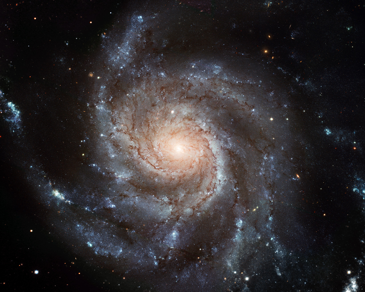 This new Hubble image reveals the gigantic Pinwheel galaxy, one of the best known examples of "grand design spirals", and its supergiant star-forming regions in unprecedented detail. The image is the largest and most detailed photo of a spiral galaxy ever taken with Hubble.